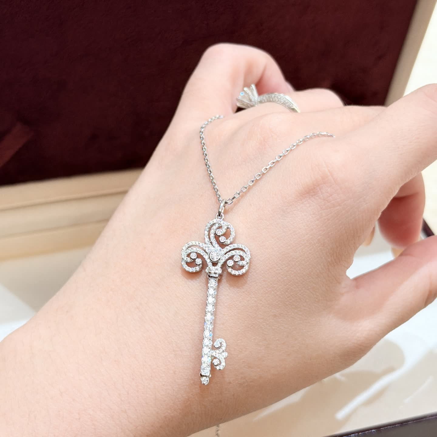 Tiffany & Co Elegant Silver Key Pendant with Diamonds
